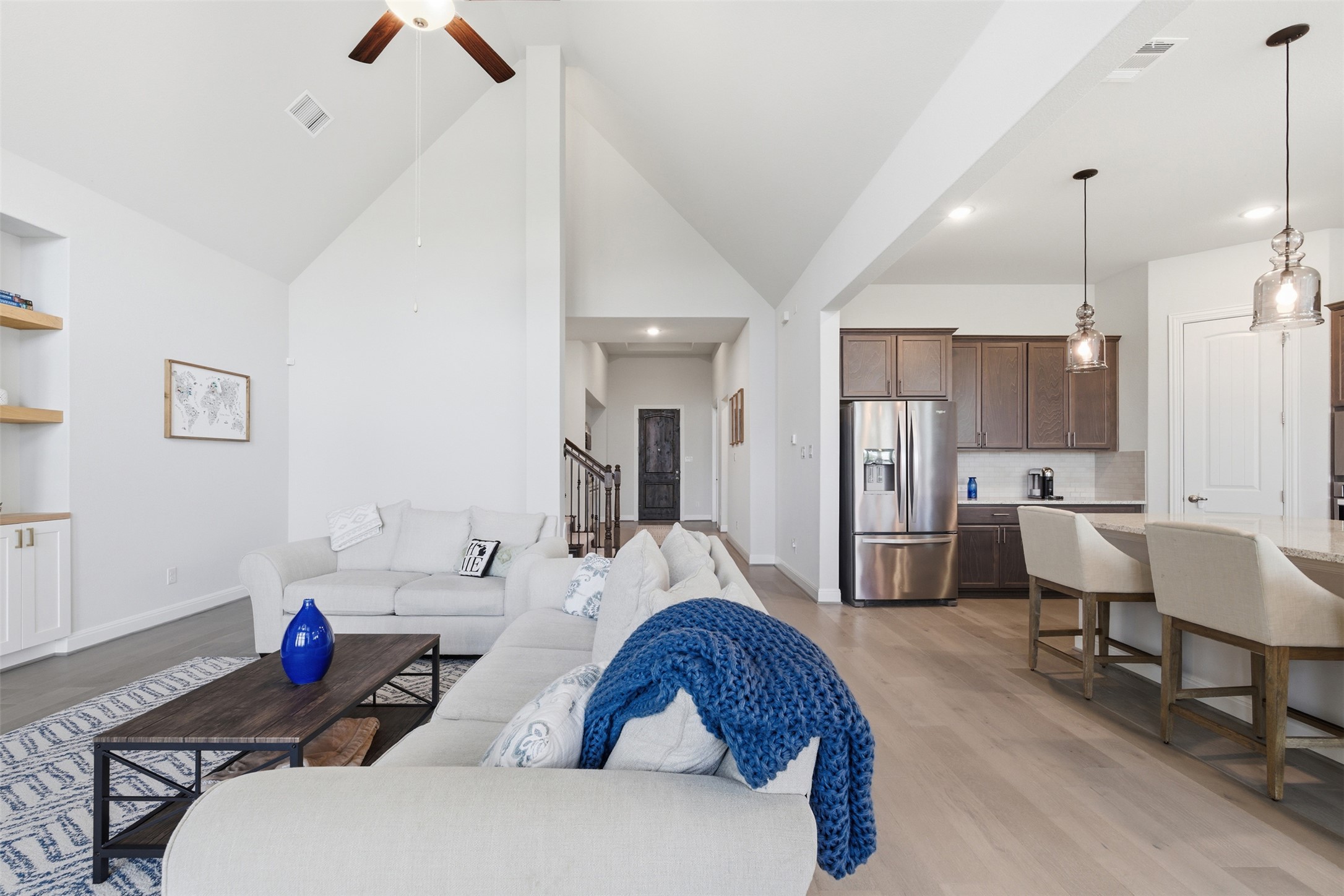 118 Bear Paw Run Georgetown, TX 78628 - Photo 8 of 35 Open concept living space featuring high vaulted ceilings, light wood flooring, and a ceiling fan
