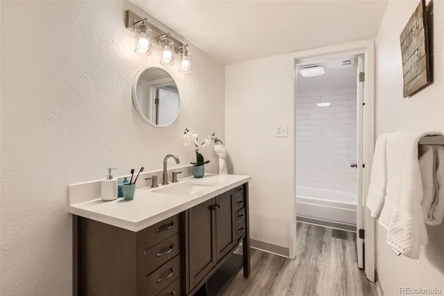 a bathroom with a sink and a mirror