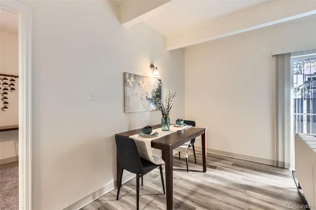 a dining room with furniture and window