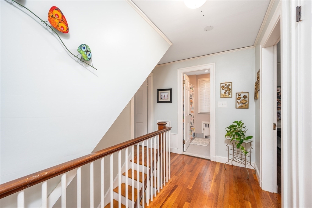 40 Waldorf Road Newton, MA 02461 - Photo 14 of 29 a view of a hallway with wooden floor and stairs