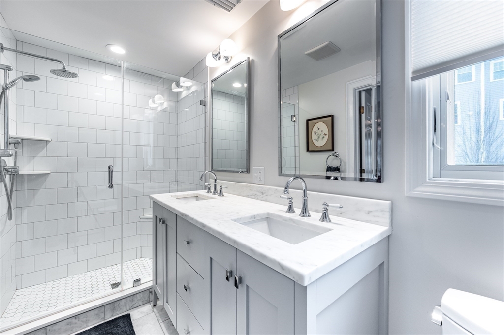 40 Waldorf Road Newton, MA 02461 - Photo 18 of 29 a bathroom with a sink and a mirror