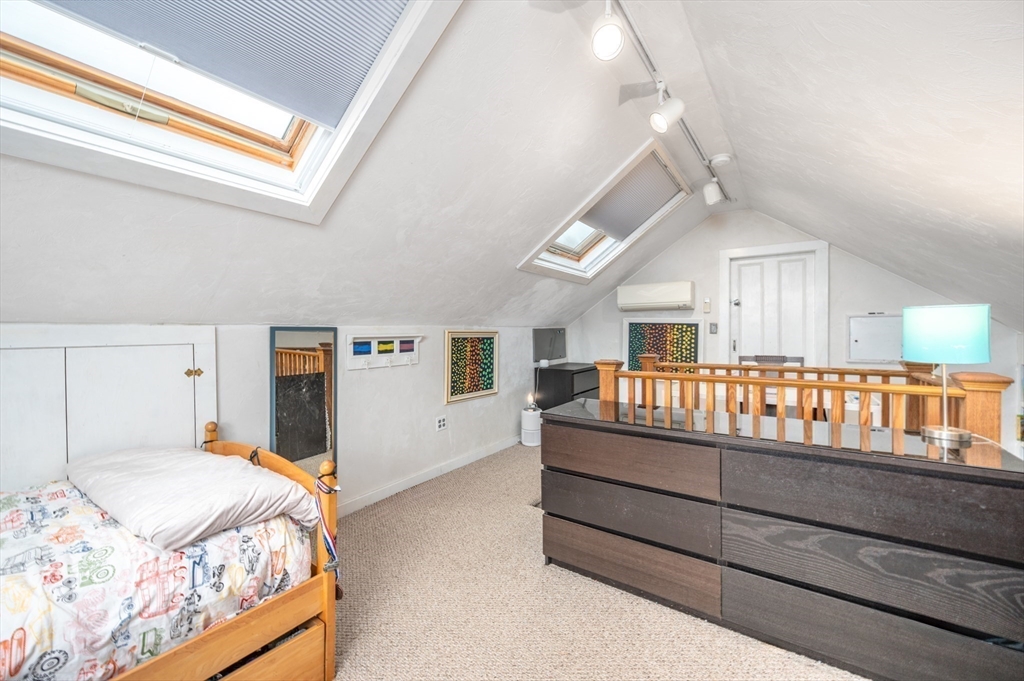 40 Waldorf Road Newton, MA 02461 - Photo 22 of 29 a bedroom with a bed and a large window