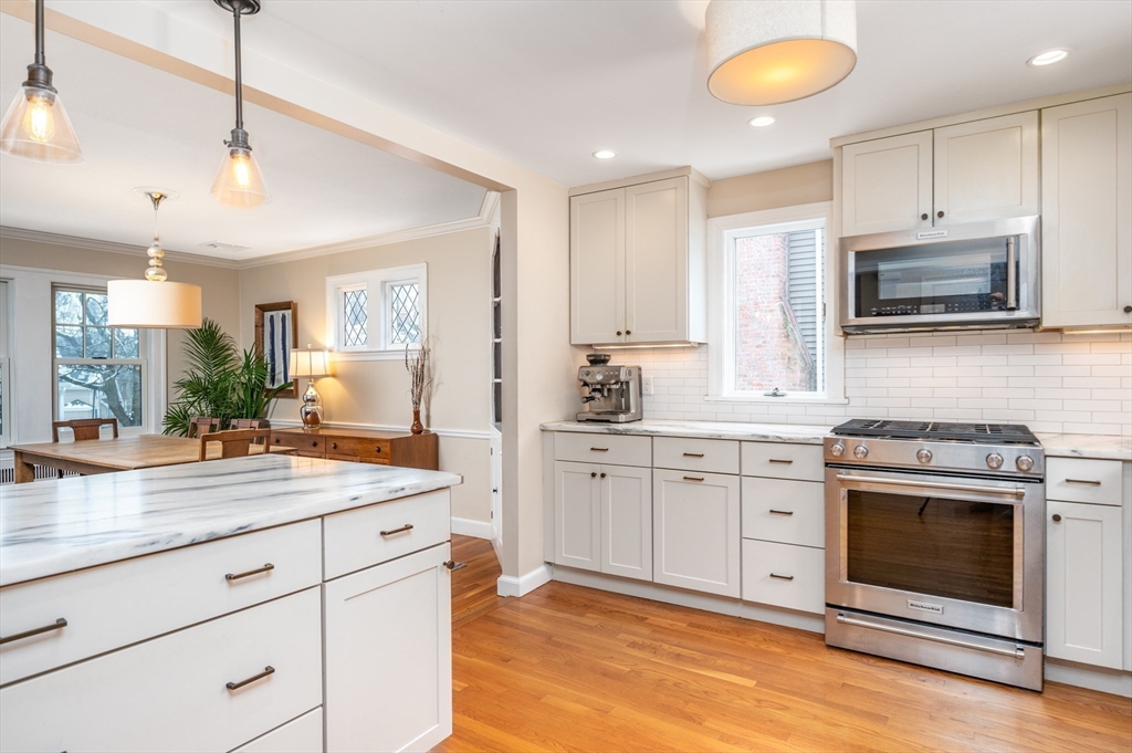 40 Waldorf Road Newton, MA 02461 - Photo 4 of 29 a kitchen with a stove microwave and cabinets