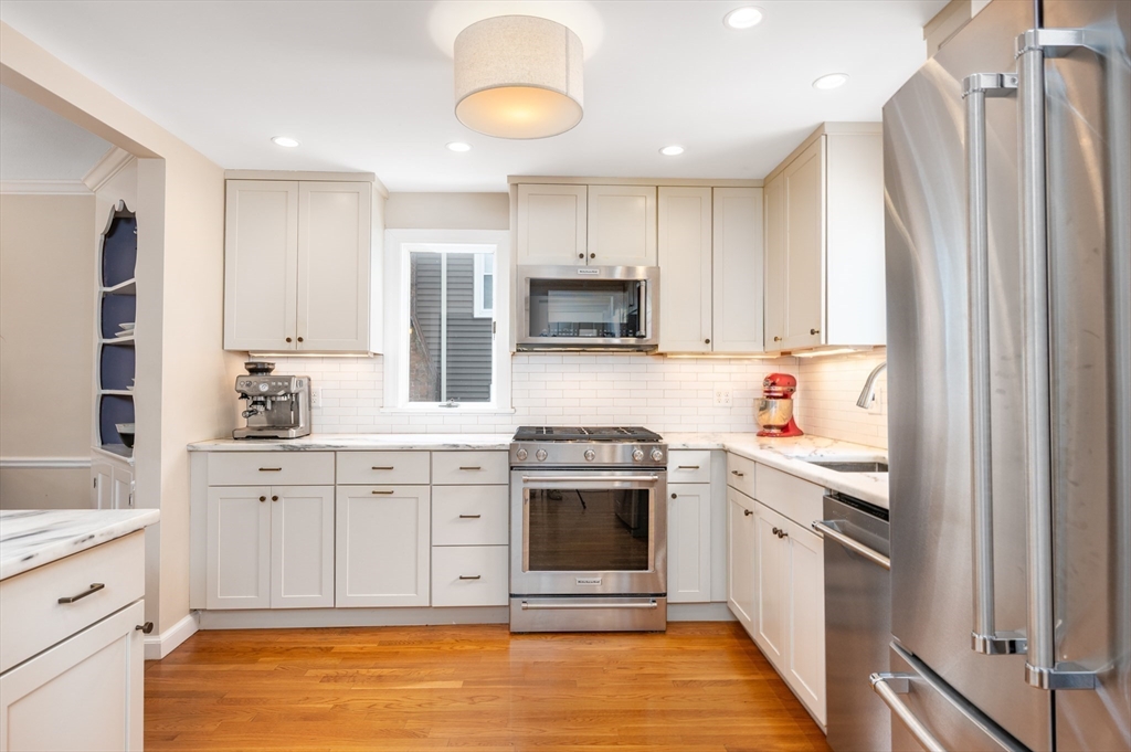 40 Waldorf Road Newton, MA 02461 - Photo 5 of 29 a kitchen with stainless steel appliances granite countertop a stove a sink and a refrigerator