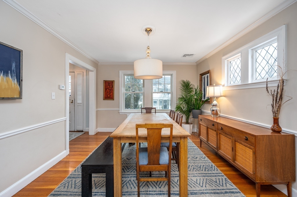 40 Waldorf Road Newton, MA 02461 - Photo 8 of 29 a dining room with wooden floor and furniture