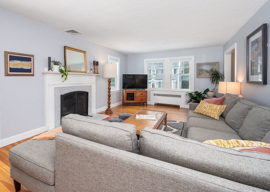 40 Waldorf Road Newton, MA 02461 - Photo 10 of 29 a living room with furniture and a fireplace