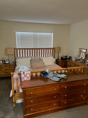 a room with a dresser and a window