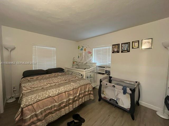 7230 Northwest 3rd Street Miami, FL 33126 - Photo 11 of 28 a bedroom with a bed and a dresser