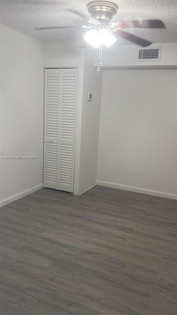 7230 Northwest 3rd Street Miami, FL 33126 - Photo 24 of 28 a view of an empty room with wooden floor