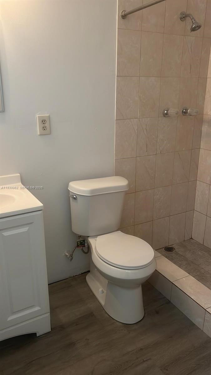 7230 Northwest 3rd Street Miami, FL 33126 - Photo 28 of 28 a white toilet sitting next to a bathroom sink