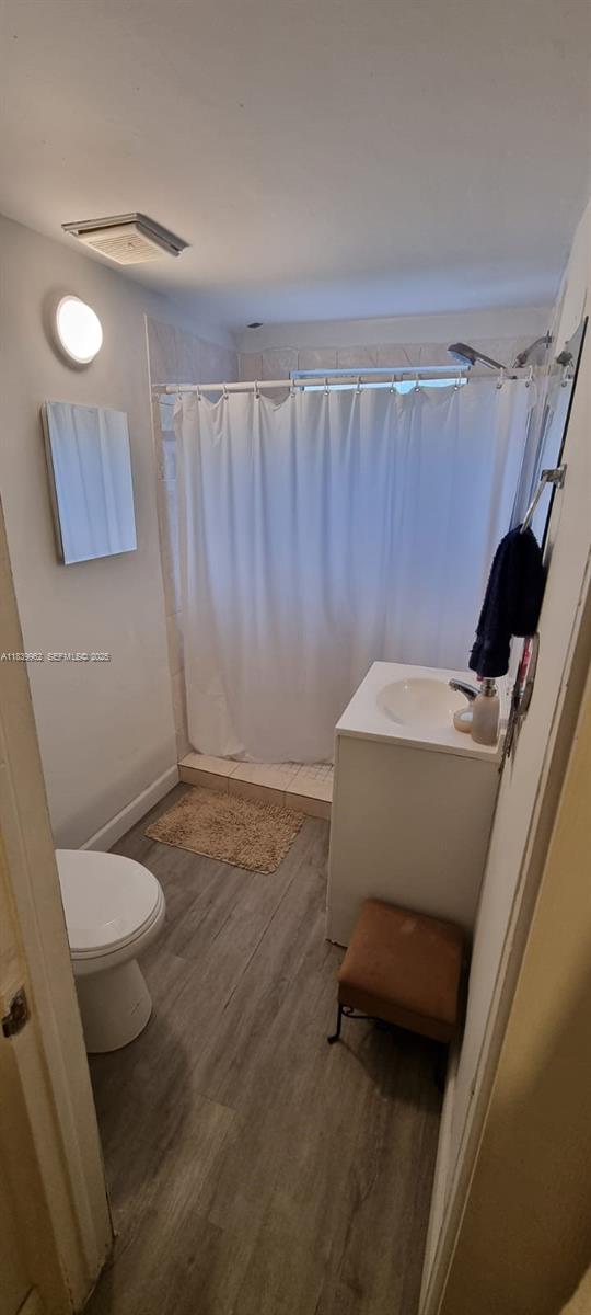 7230 Northwest 3rd Street Miami, FL 33126 - Photo 7 of 28 a bathroom with a sink and a toilet