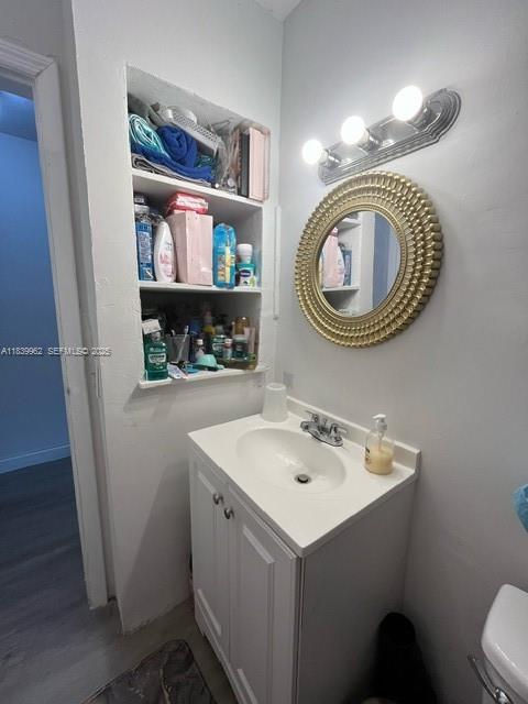 7230 Northwest 3rd Street Miami, FL 33126 - Photo 10 of 28 a bathroom with a sink a toilet and a mirror