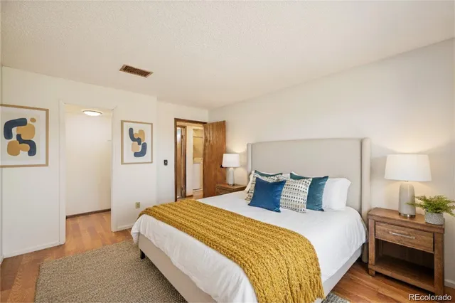 a bedroom with a bed and a night stand