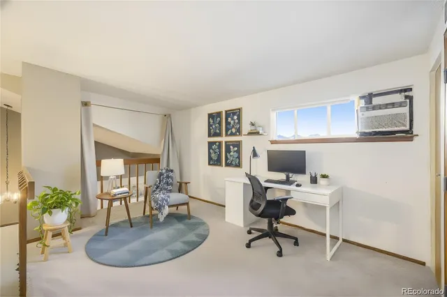 a workspace with furniture and window