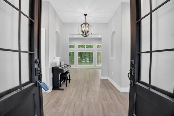 a bathroom with a granite countertop sink toilet and mirror