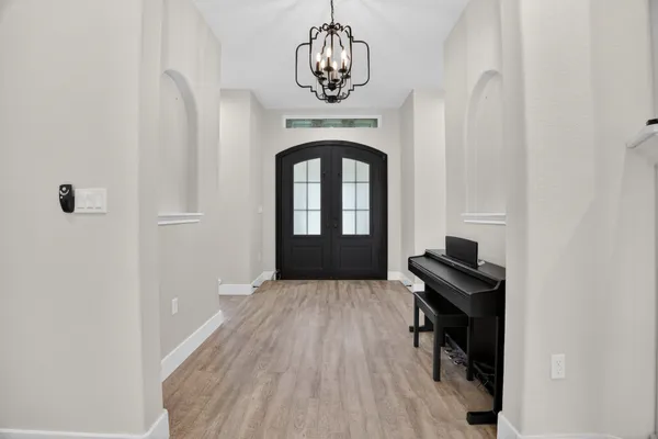 a view of a room with gym equipment and a window