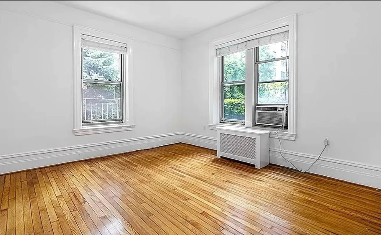 77 West 85th Street, Unit 1C Manhattan, NY 10024 - Photo 3 of 10 a view of an empty room with wooden floor and a window