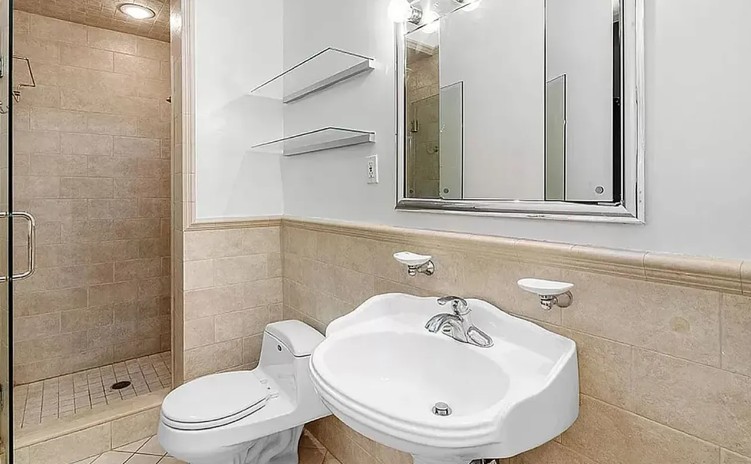 77 West 85th Street, Unit 1C Manhattan, NY 10024 - Photo 8 of 10 a bathroom with a sink a toilet and shower
