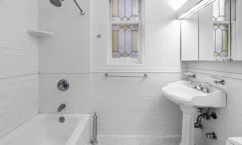 77 West 85th Street, Unit 1C Manhattan, NY 10024 - Photo 9 of 10 a bathroom with a sink a toilet and bathtub