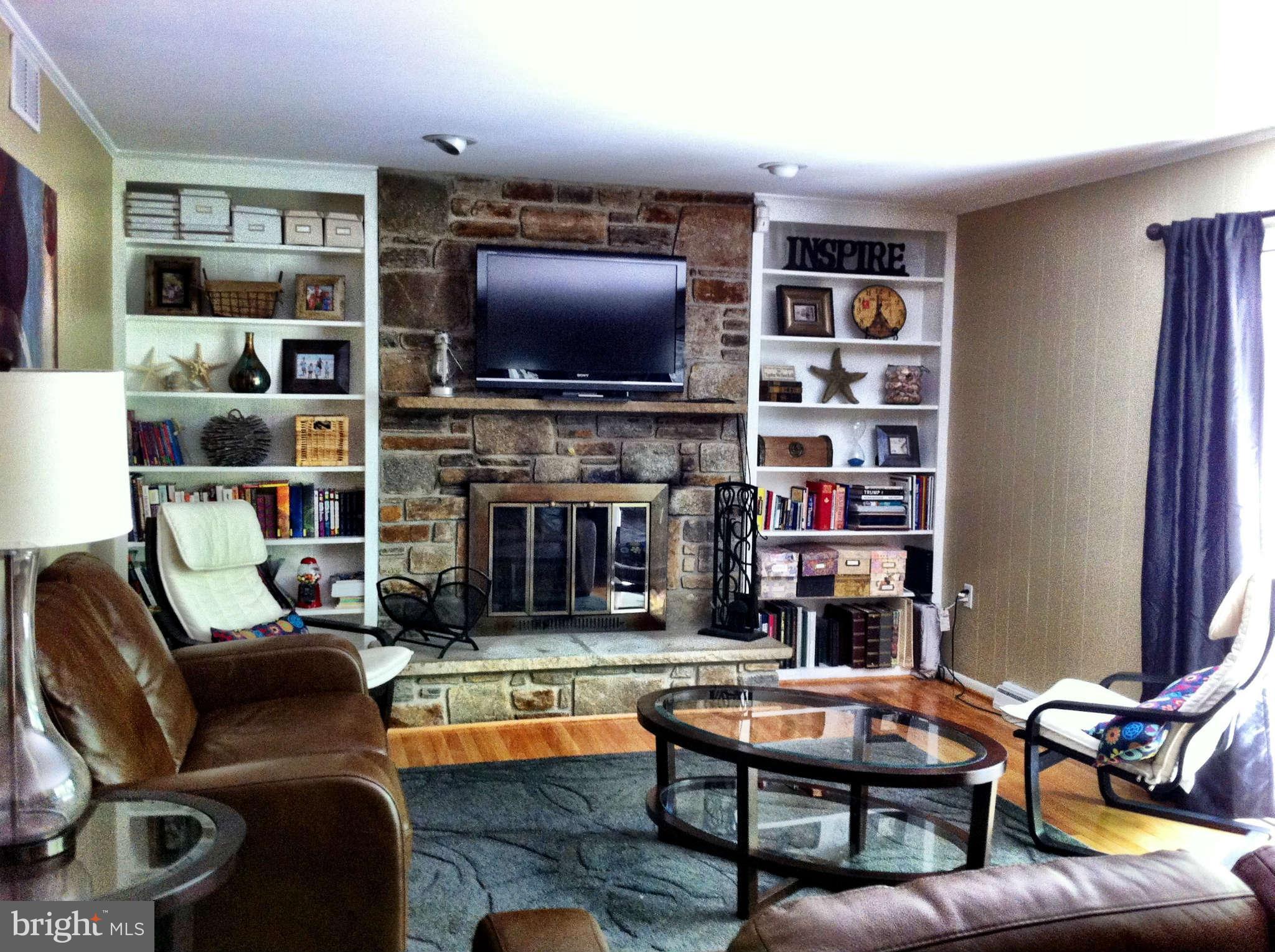 5503 Hines Road Frederick, MD 21704 - Photo 15 of 22 build in shelves and fireplace