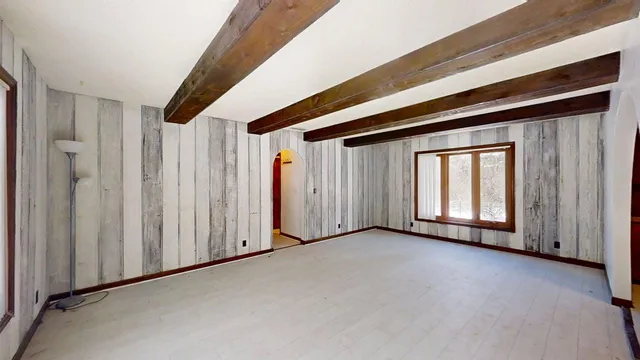 a view of a livingroom with wooden floor