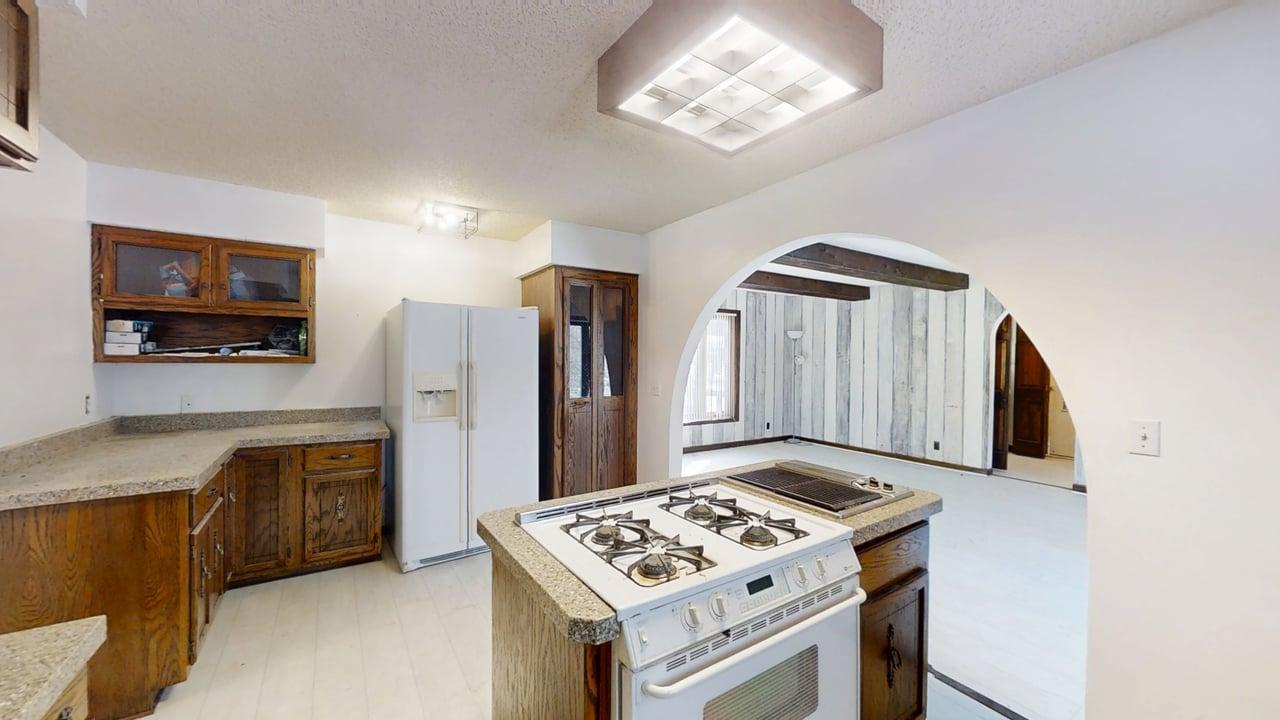 1756 West Ravina Park Road Decatur, IL 62526 - Photo 20 of 47 a kitchen with stainless steel appliances granite countertop a stove refrigerator and microwave