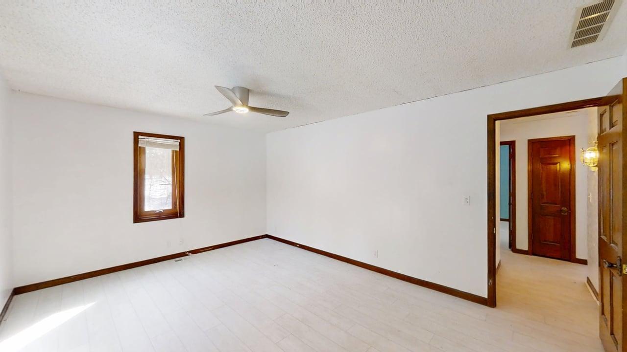 1756 West Ravina Park Road Decatur, IL 62526 - Photo 25 of 47 wooden floor in an empty room with a window