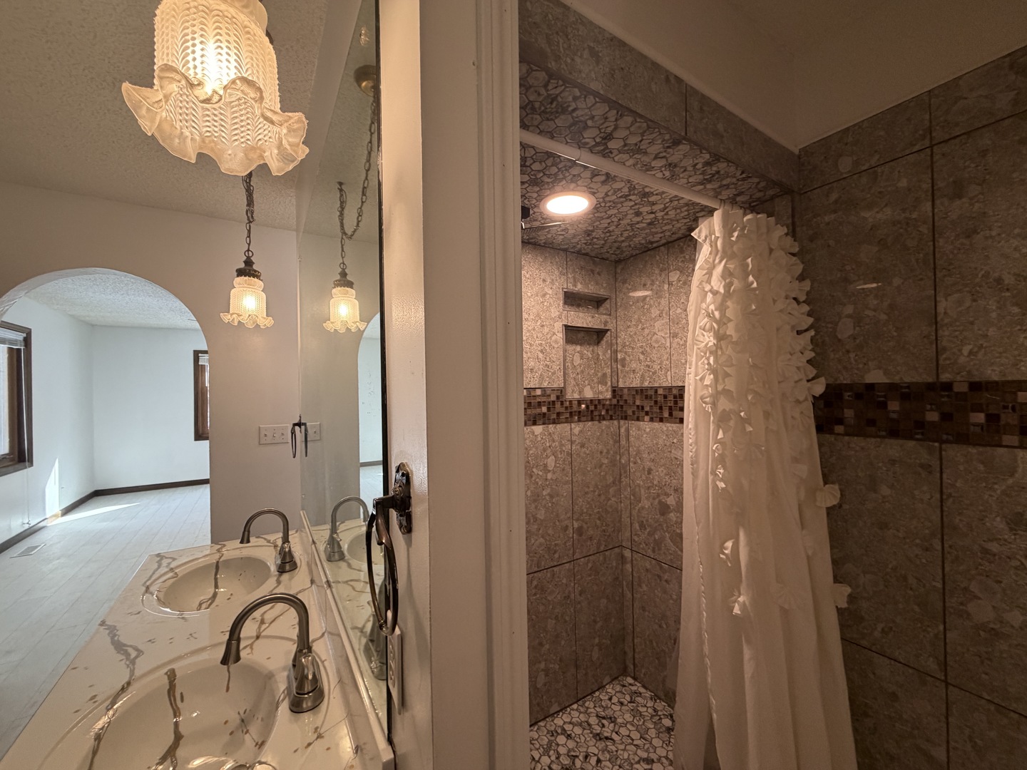 1756 West Ravina Park Road Decatur, IL 62526 - Photo 27 of 47 a bathroom with a granite countertop shower a sink and a mirror