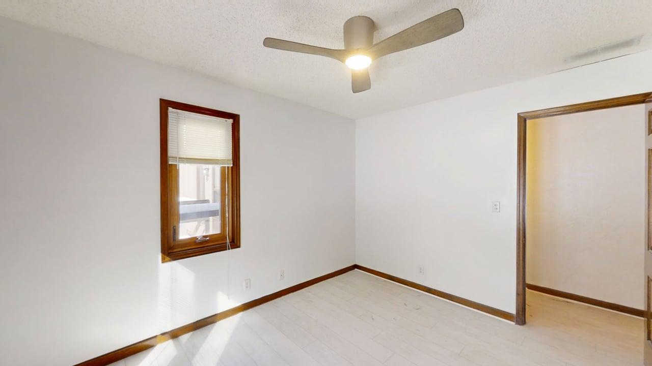 1756 West Ravina Park Road Decatur, IL 62526 - Photo 33 of 47 an empty room with windows and fan