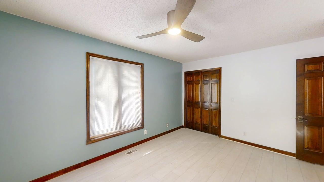 1756 West Ravina Park Road Decatur, IL 62526 - Photo 37 of 47 an empty room with closet and windows