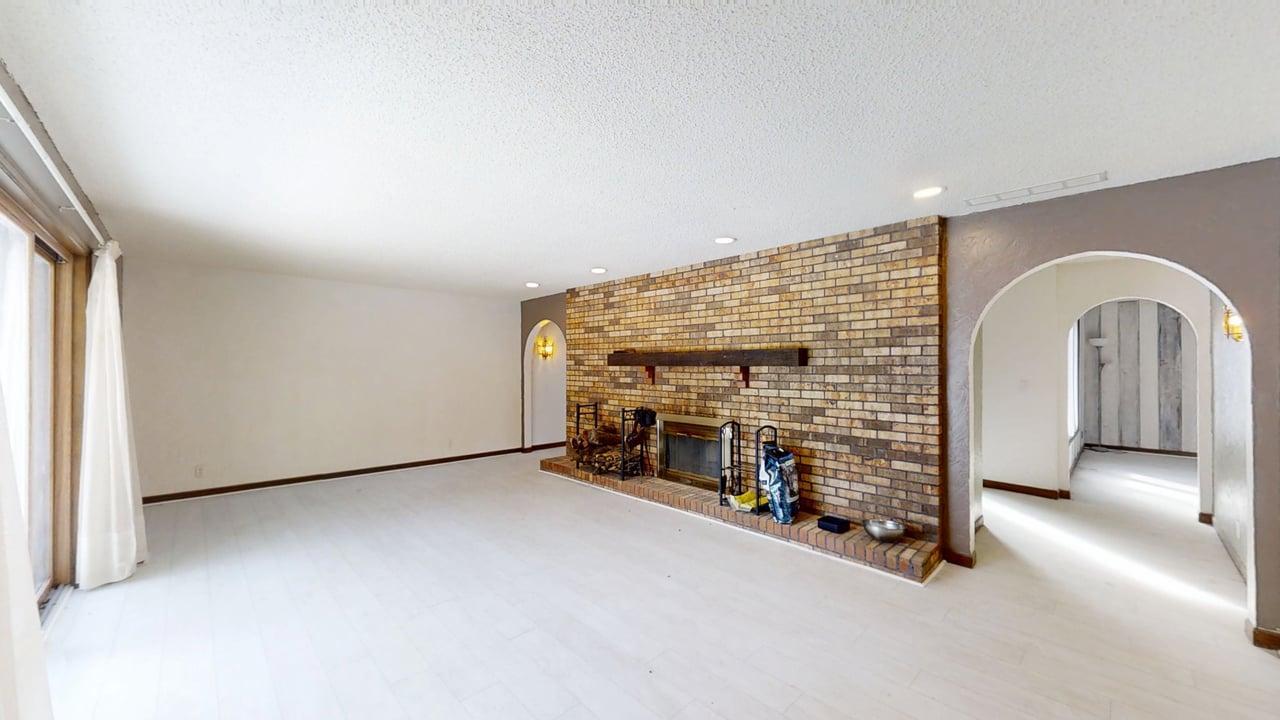 1756 West Ravina Park Road Decatur, IL 62526 - Photo 7 of 47 a view of an empty room with fireplace and a window