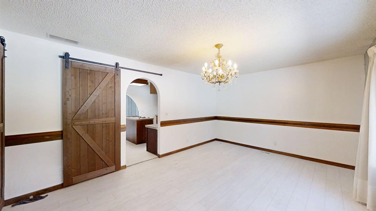 1756 West Ravina Park Road Decatur, IL 62526 - Photo 9 of 47 a room with a chandelier