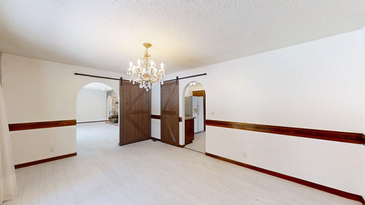 1756 West Ravina Park Road Decatur, IL 62526 - Photo 10 of 47 a view of a livingroom with a chandelier