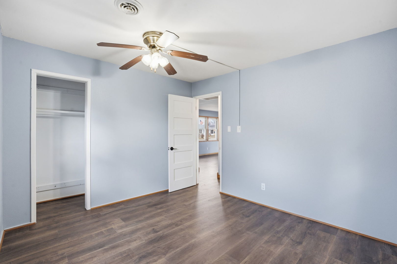 2515 West 69th Street Davenport, IA 52806 - Photo 11 of 15 a view of an empty room with wooden floor