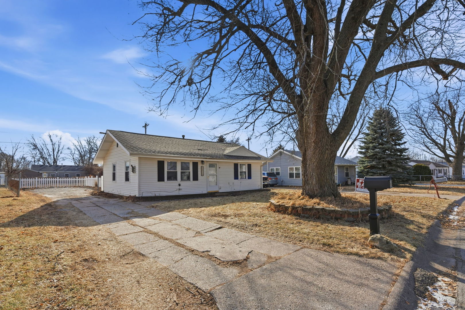 2515 West 69th Street Davenport, IA 52806 - Photo 2 of 15 a view of a house with a yard covered in snow