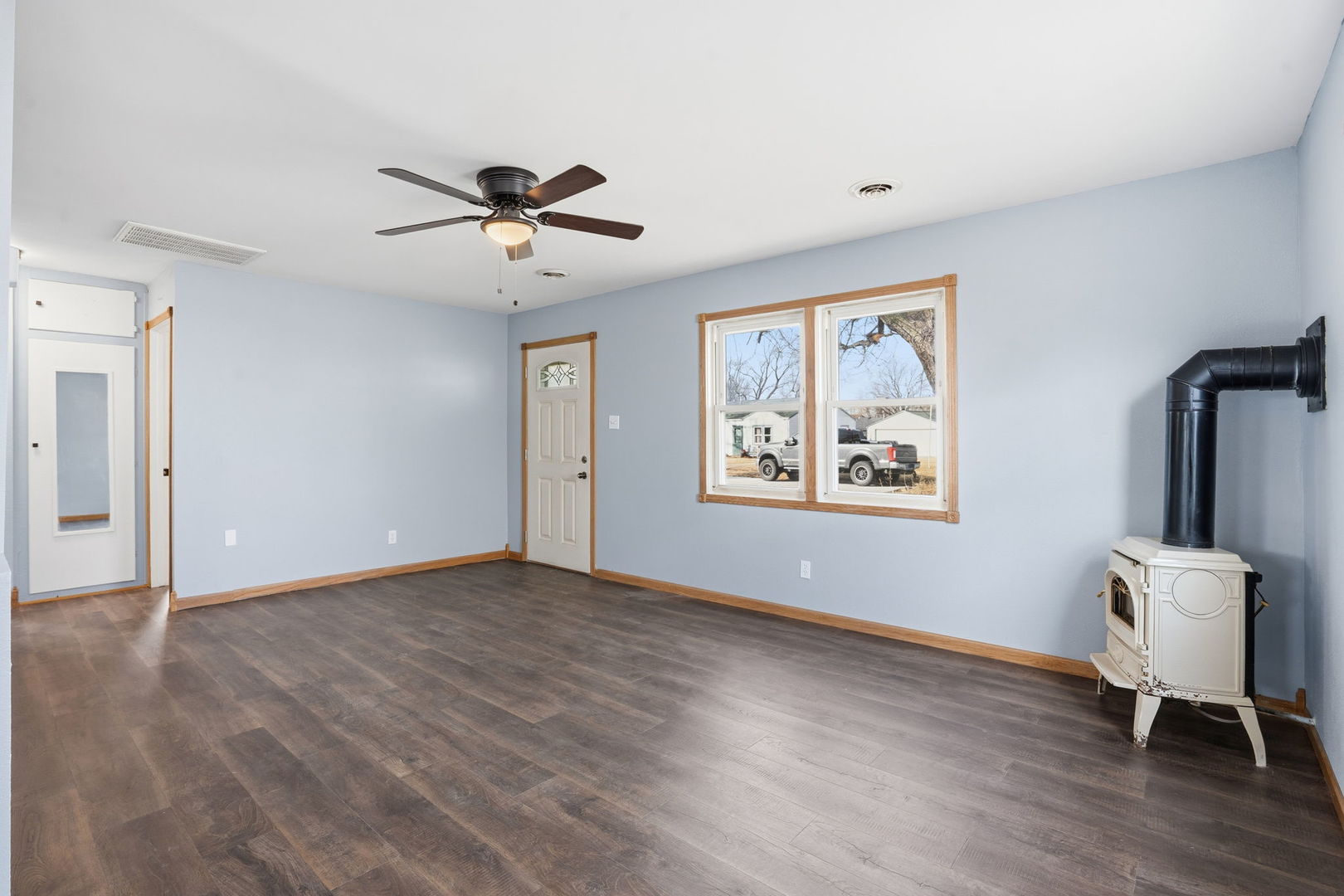 2515 West 69th Street Davenport, IA 52806 - Photo 3 of 15 a view of an empty room with window and hardwood floor