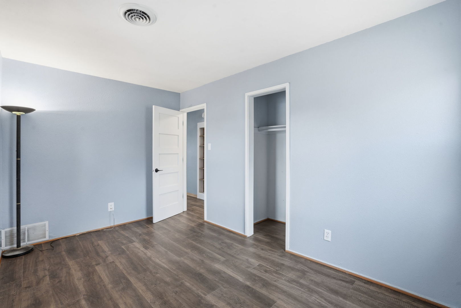 2515 West 69th Street Davenport, IA 52806 - Photo 9 of 15 a view of an empty room with wooden floor and closet