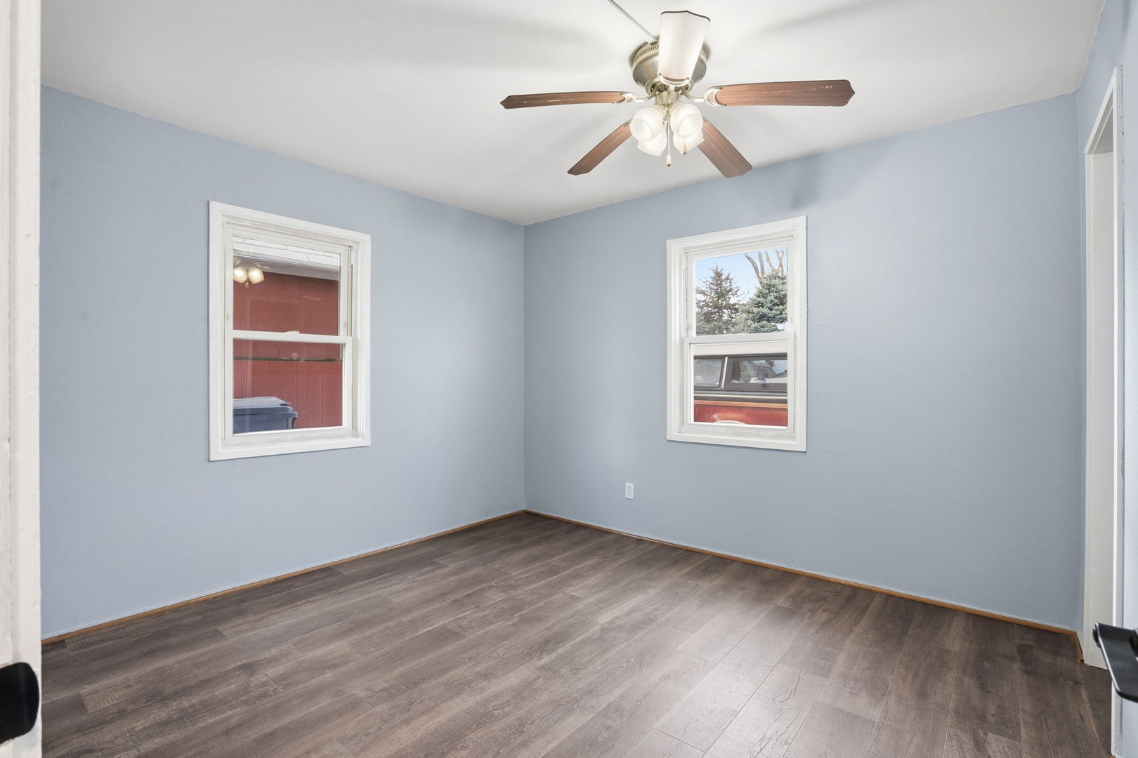 2515 West 69th Street Davenport, IA 52806 - Photo 10 of 15 a view of an empty room with wooden floor and a window