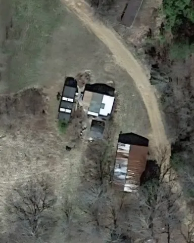 an aerial view of a wooden floor with a yard