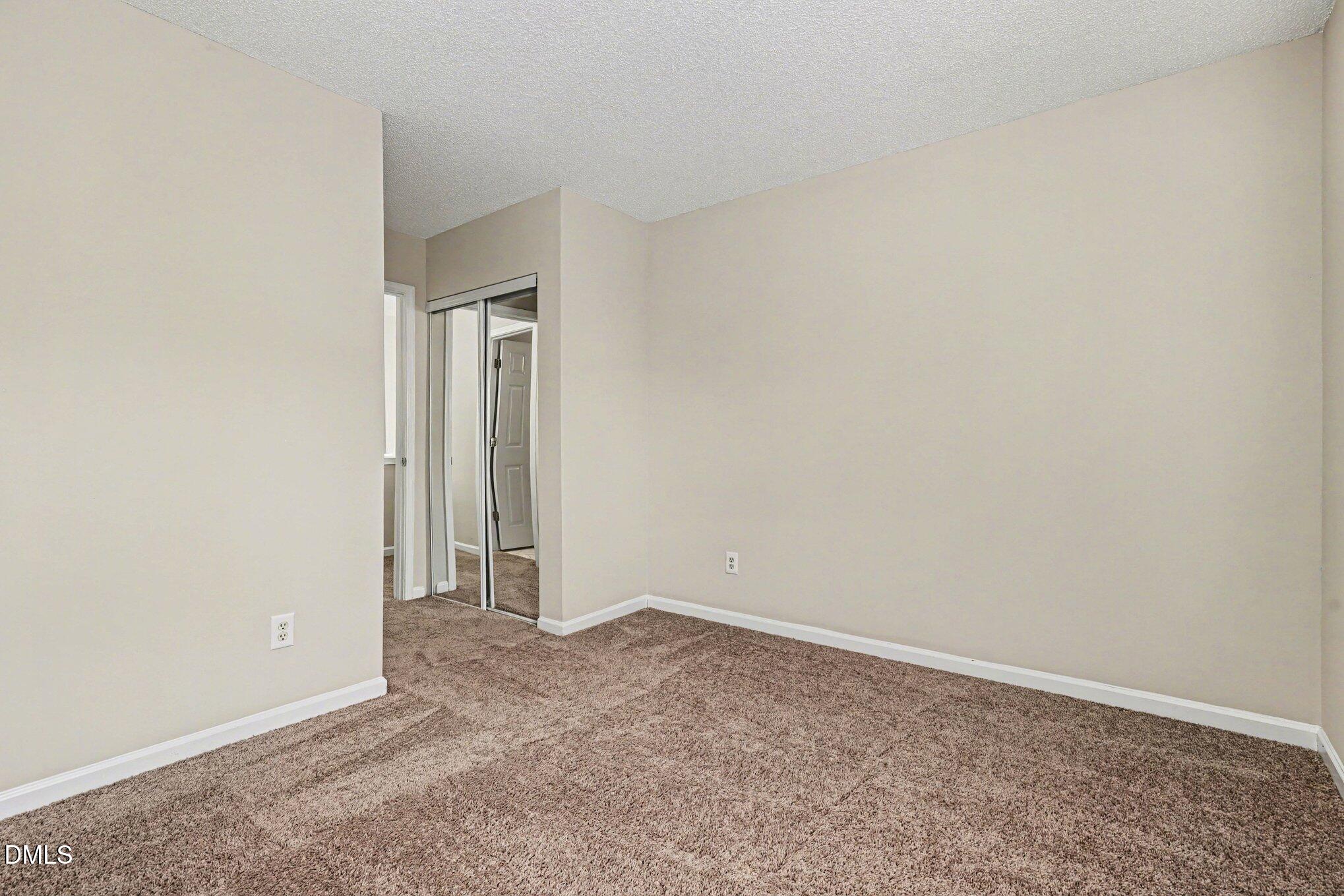 9904 Treymore Drive Raleigh, NC 27617 - Photo 18 of 33 a view of an empty room