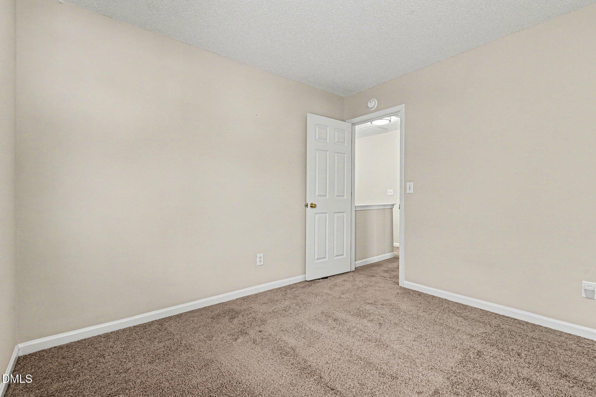 9904 Treymore Drive Raleigh, NC 27617 - Photo 22 of 33 a view of an empty room