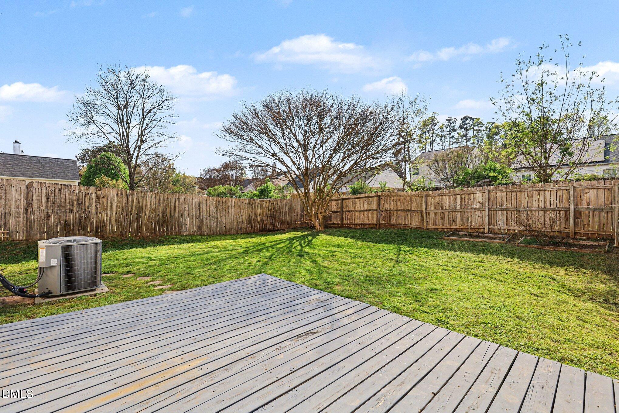 9904 Treymore Drive Raleigh, NC 27617 - Photo 23 of 33 a view of a backyard with wooden fence