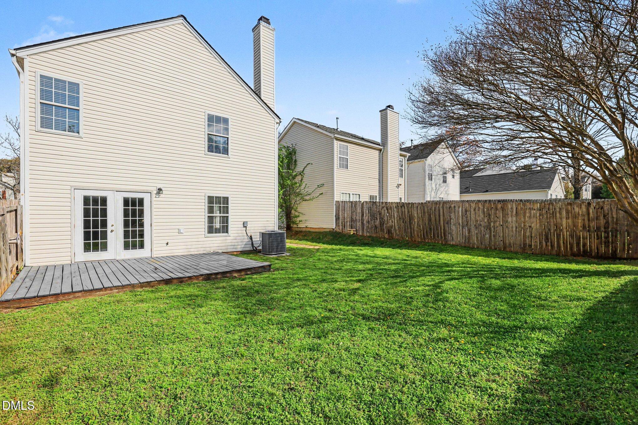 9904 Treymore Drive Raleigh, NC 27617 - Photo 25 of 33 a view of a house with a yard