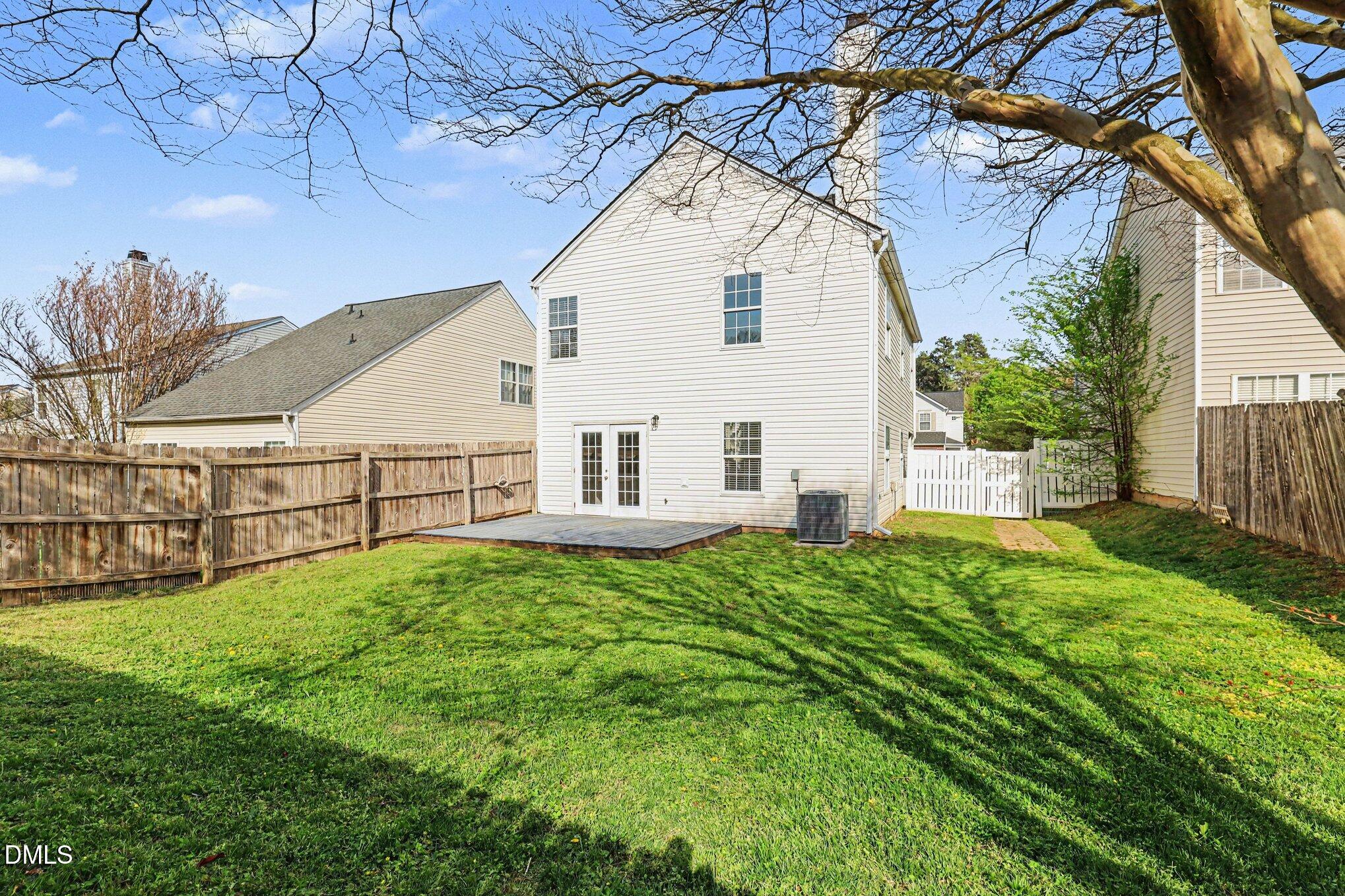 9904 Treymore Drive Raleigh, NC 27617 - Photo 26 of 33 a view of white house with a yard