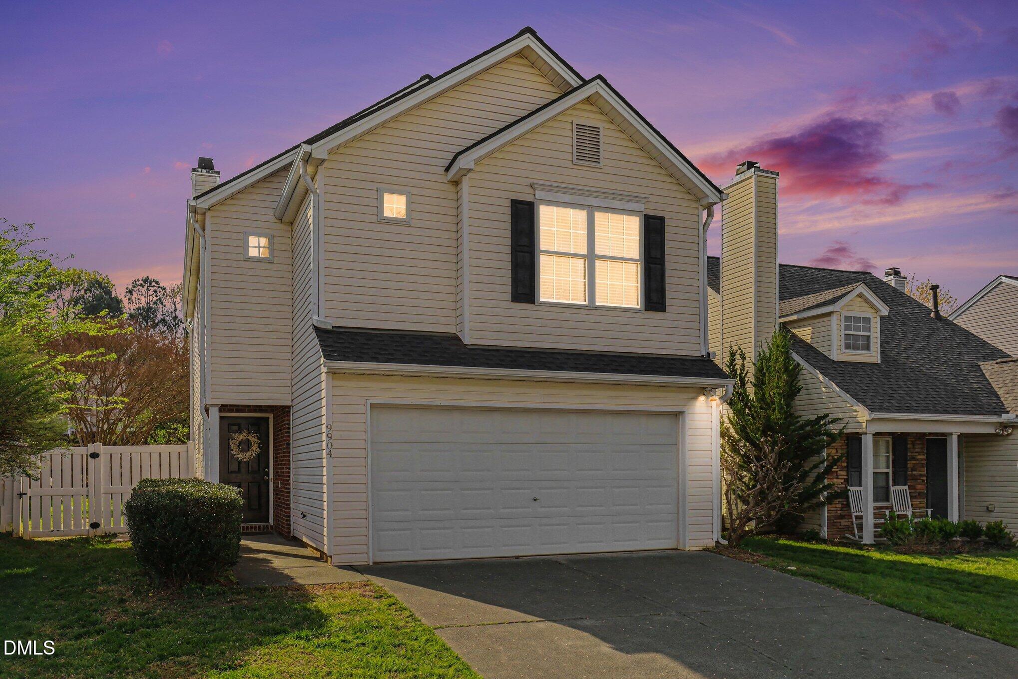 9904 Treymore Drive Raleigh, NC 27617 - Photo 2 of 33 a front view of a house with a yard