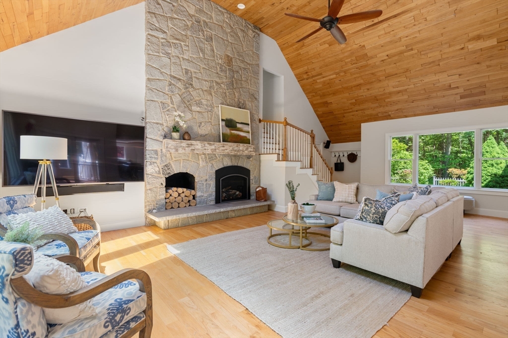 199 Bolton Road Harvard, MA 01451 - Photo 3 of 35 a living room with furniture large window and a fireplace