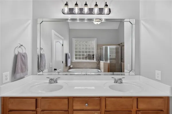 a bathroom with a tub and a shower
