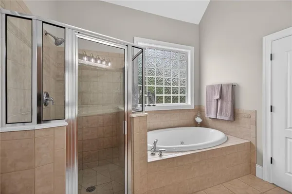 a white bath tub sitting next to a window