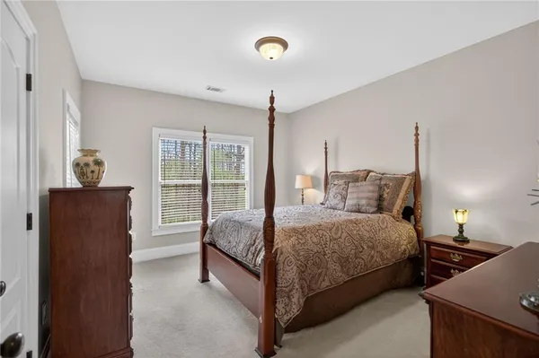 a living room with furniture ceiling fan and a rug