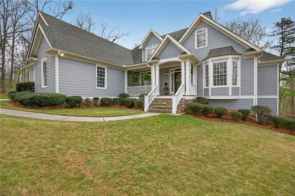 a front view of a house with garden